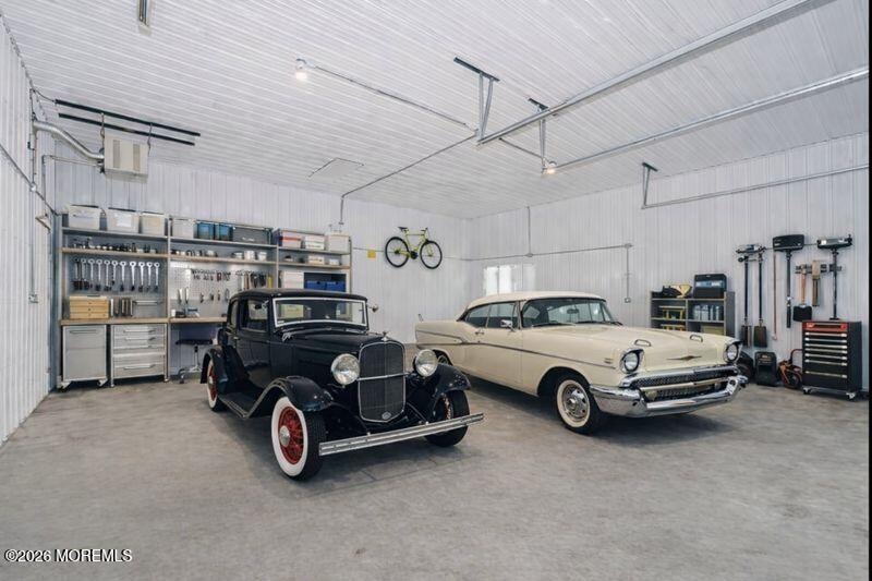 66 Cedar Swamp Road Jackson, NJ 08527 - Photo 20 of 56 a car parked in a garage