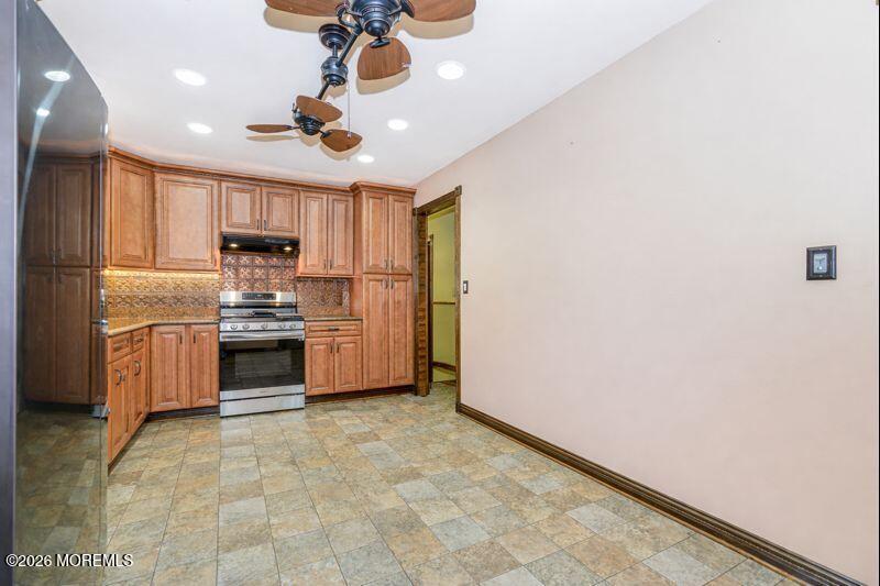 66 Cedar Swamp Road Jackson, NJ 08527 - Photo 27 of 56 a kitchen with stainless steel appliances a refrigerator sink and microwave