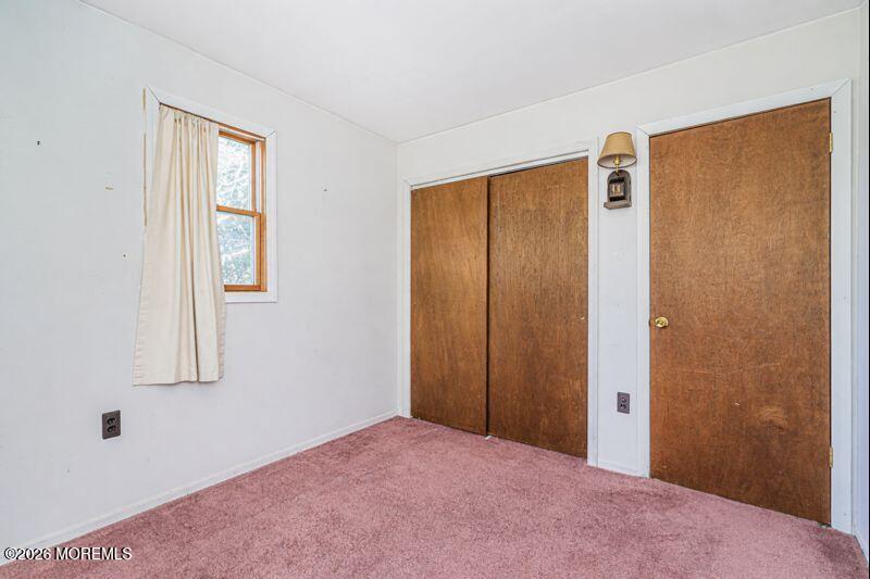 66 Cedar Swamp Road Jackson, NJ 08527 - Photo 29 of 56 a view of an empty room with window and closet area