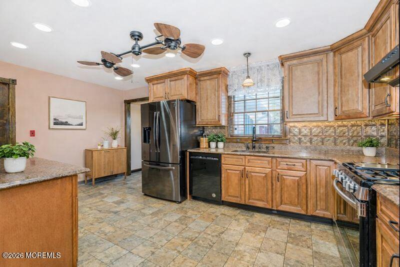 66 Cedar Swamp Road Jackson, NJ 08527 - Photo 5 of 56 a kitchen with stainless steel appliances granite countertop a refrigerator a stove a sink dishwasher and a refrigerator