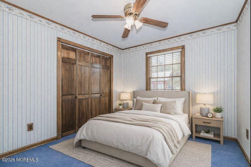 66 Cedar Swamp Road Jackson, NJ 08527 - Photo 9 of 56 a bedroom with a large bed and a chandelier fan