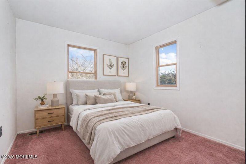 66 Cedar Swamp Road Jackson, NJ 08527 - Photo 10 of 56 a bedroom with a bed and a window