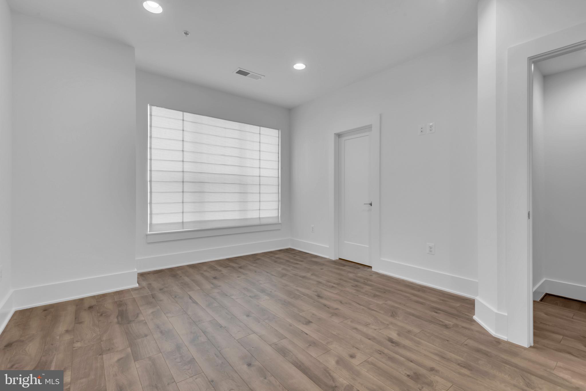 11366 Emerald Park Road Potomac, MD 20854 - Photo 28 of 59 wooden floor in an empty room with a window