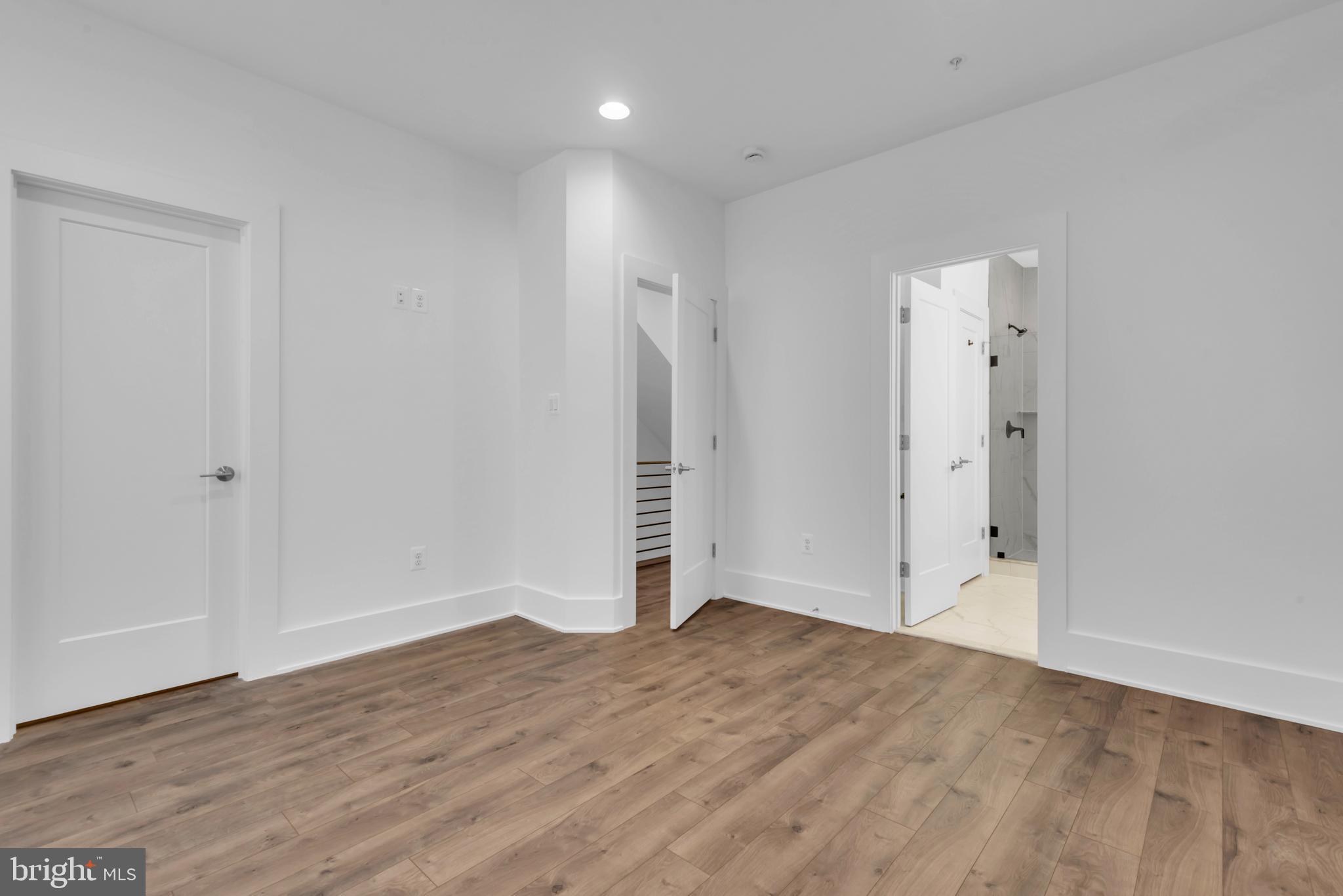 11366 Emerald Park Road Potomac, MD 20854 - Photo 29 of 59 an empty room with wooden floor and closet