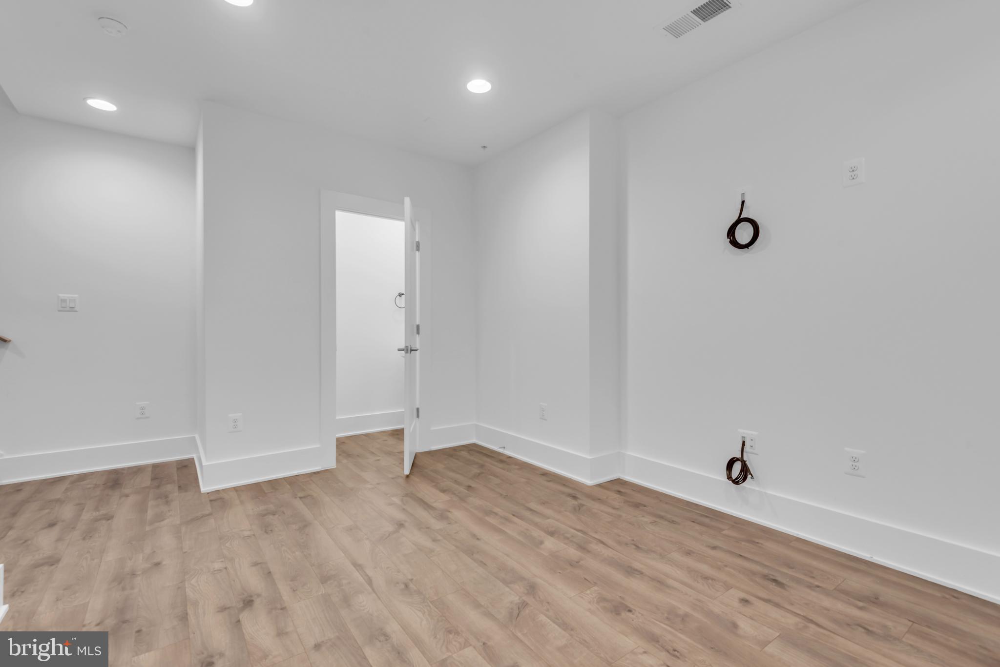 11366 Emerald Park Road Potomac, MD 20854 - Photo 47 of 59 an empty room with wooden floor and windows