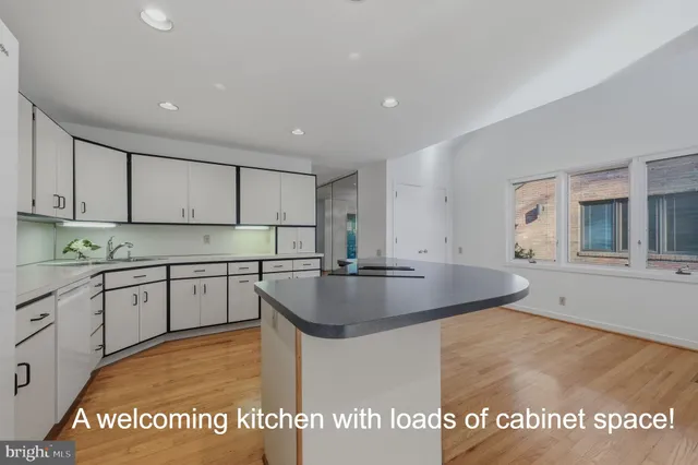 a kitchen with stainless steel appliances granite countertop a sink dishwasher and stove
