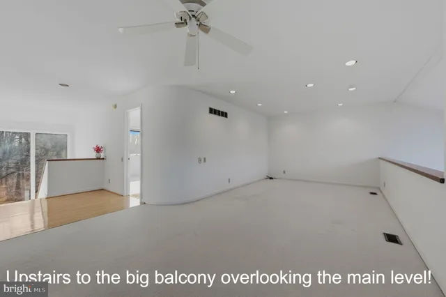 a view of a livingroom with furniture and staircase