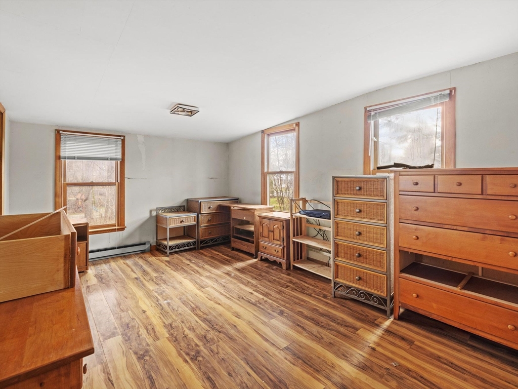 18 Cedar Street Westborough, MA 01581 - Photo 17 of 26 a bedroom with furniture and window