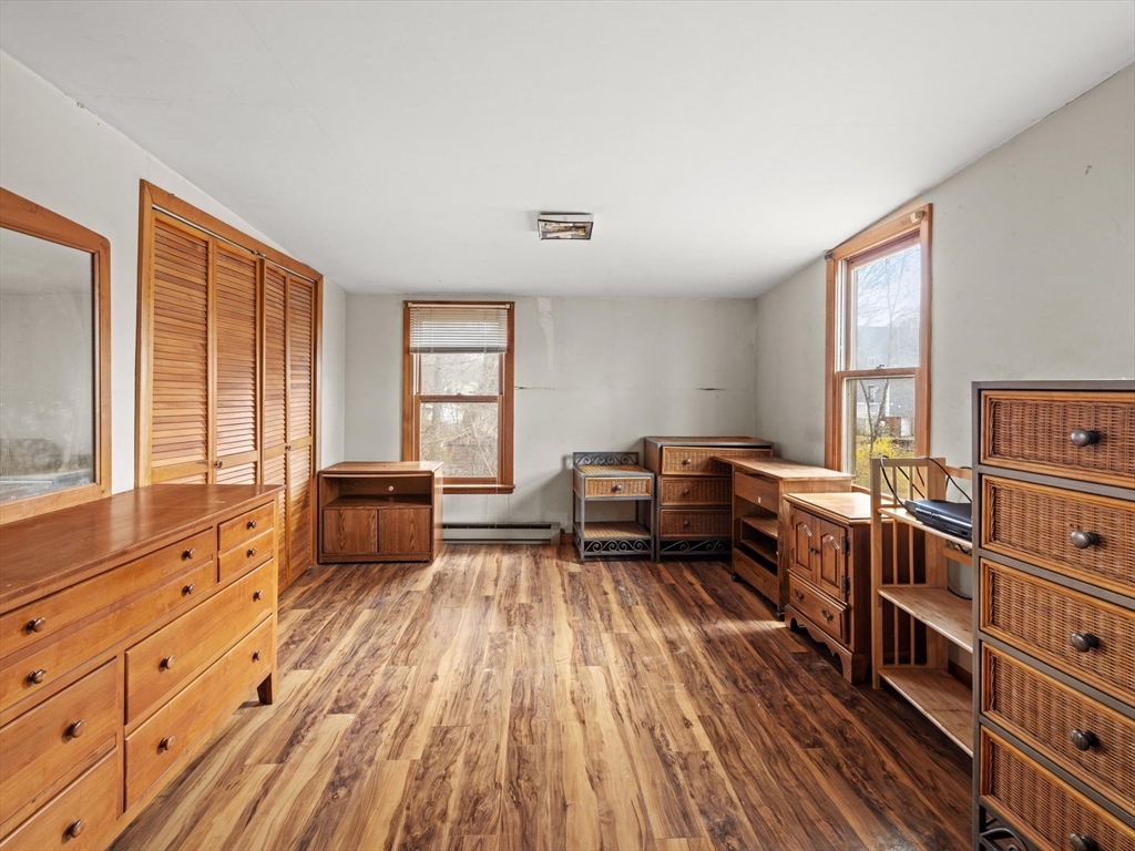 18 Cedar Street Westborough, MA 01581 - Photo 18 of 26 a living room with furniture and a wooden floor
