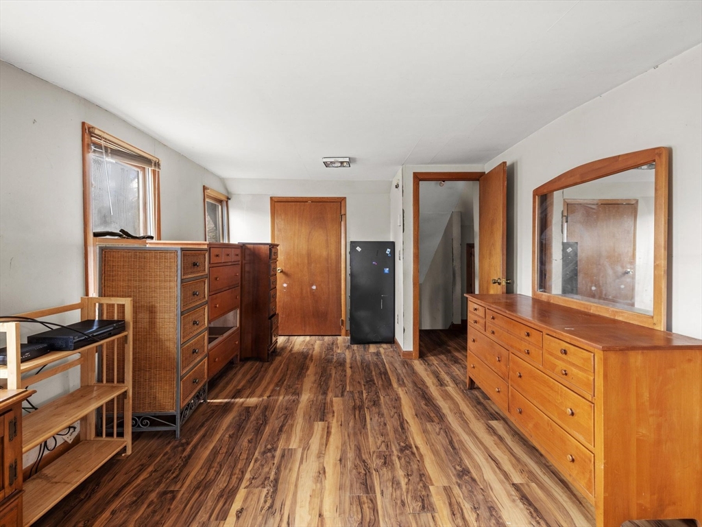 18 Cedar Street Westborough, MA 01581 - Photo 19 of 26 a view of a livingroom with wooden floor and furniture