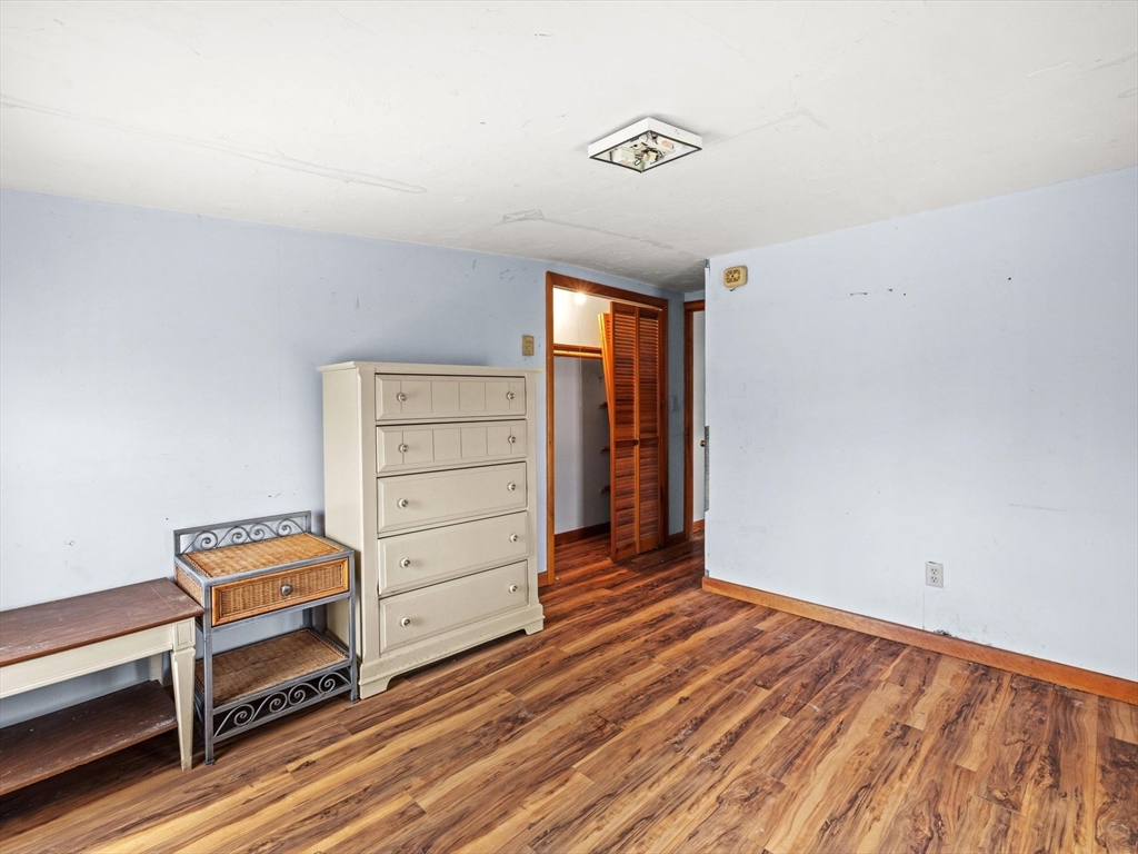 18 Cedar Street Westborough, MA 01581 - Photo 21 of 26 a view of room with stairs and a dresser