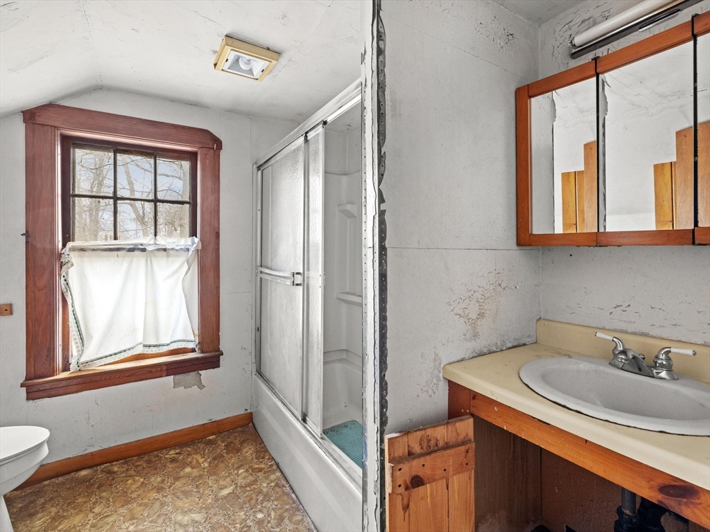 18 Cedar Street Westborough, MA 01581 - Photo 22 of 26 a bathroom with a sink and a window