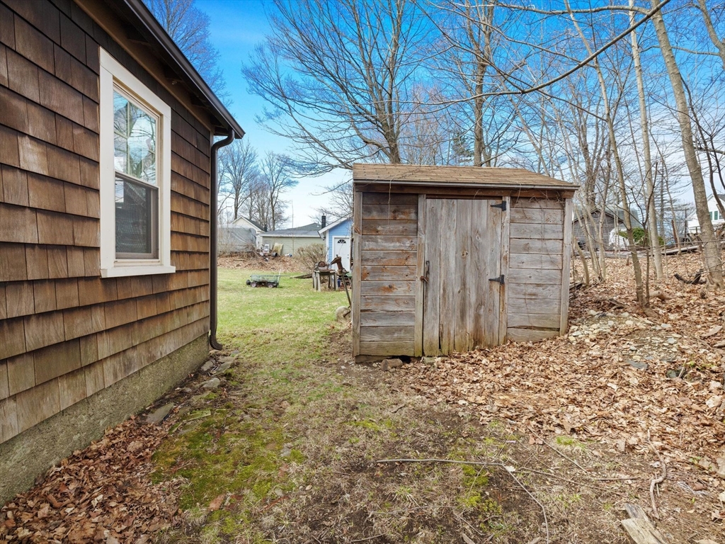 18 Cedar Street Westborough, MA 01581 - Photo 23 of 26 a view of a house with a yard