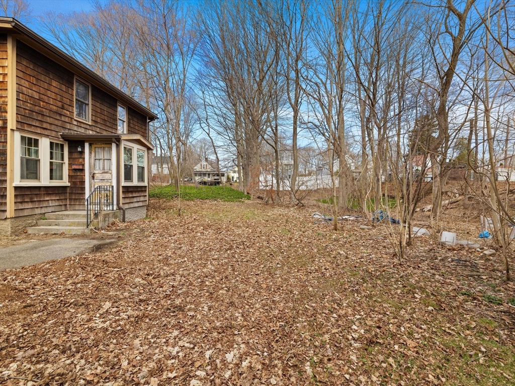 18 Cedar Street Westborough, MA 01581 - Photo 3 of 26 a backyard of a house with large trees