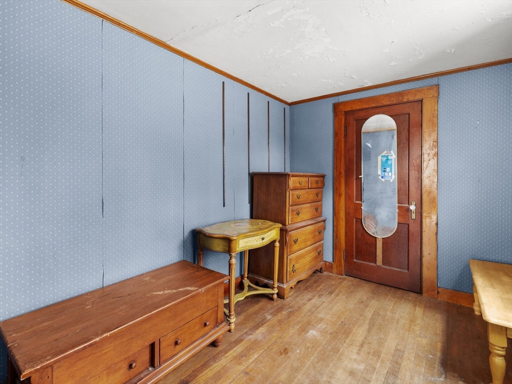 18 Cedar Street Westborough, MA 01581 - Photo 5 of 26 a room with a chair and a table