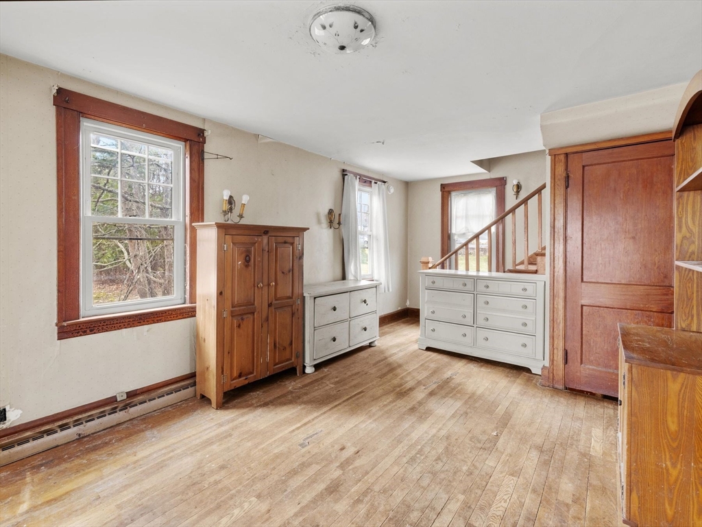 18 Cedar Street Westborough, MA 01581 - Photo 10 of 26 an empty room with windows and cabinet
