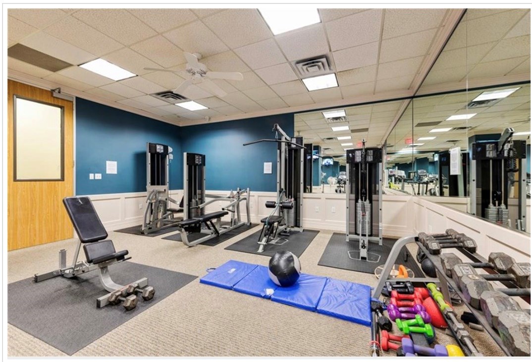 1801 Lavaca Street, Unit 11A Austin, TX 78701 - Photo 14 of 21 a room with gym equipment and a table