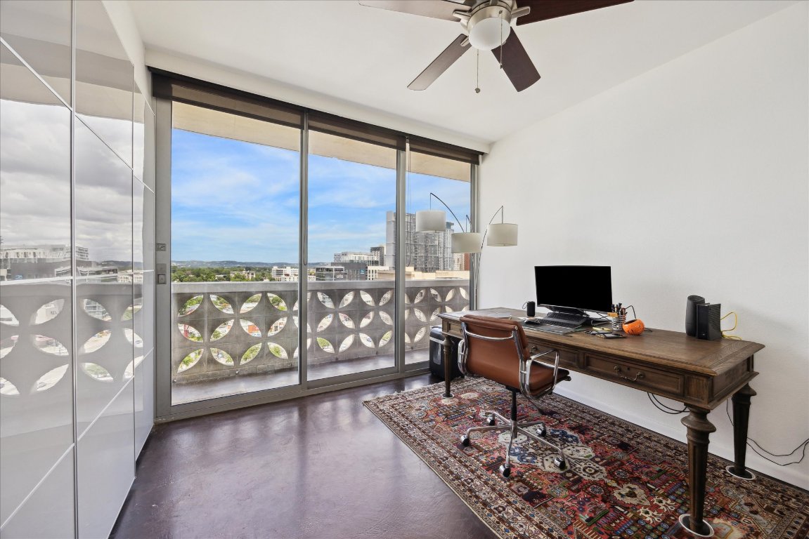 1801 Lavaca Street, Unit 11A Austin, TX 78701 - Photo 7 of 21 a view of a workspace with furniture and a window