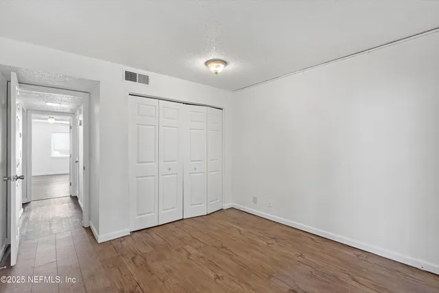a view of a livingroom with wooden floor