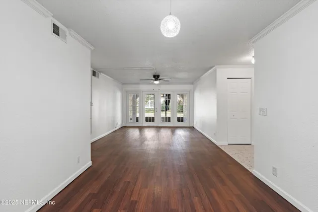 a view of livingroom and hardwood floor