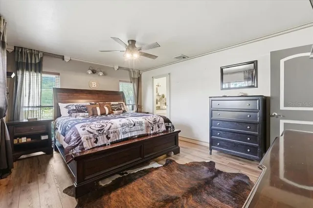 a bedroom with a bed and a dresser