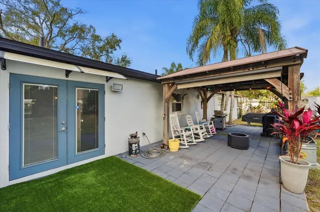 a view of a patio with chair and tables