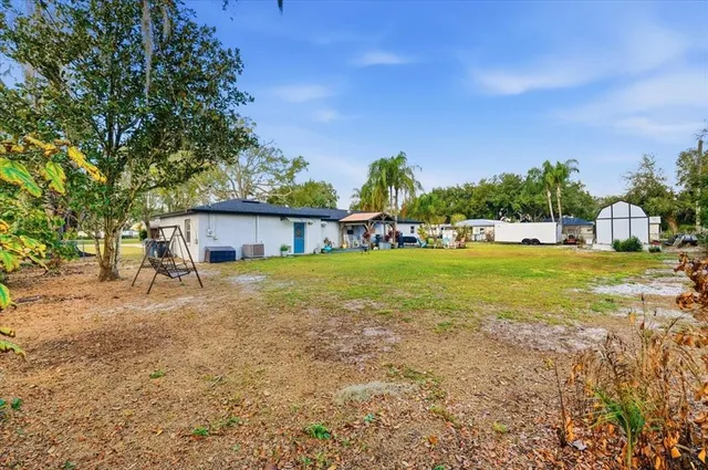 a view of a house with a big yard