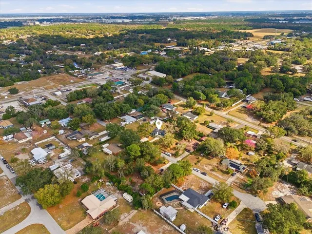 an aerial view of residential building with parking space