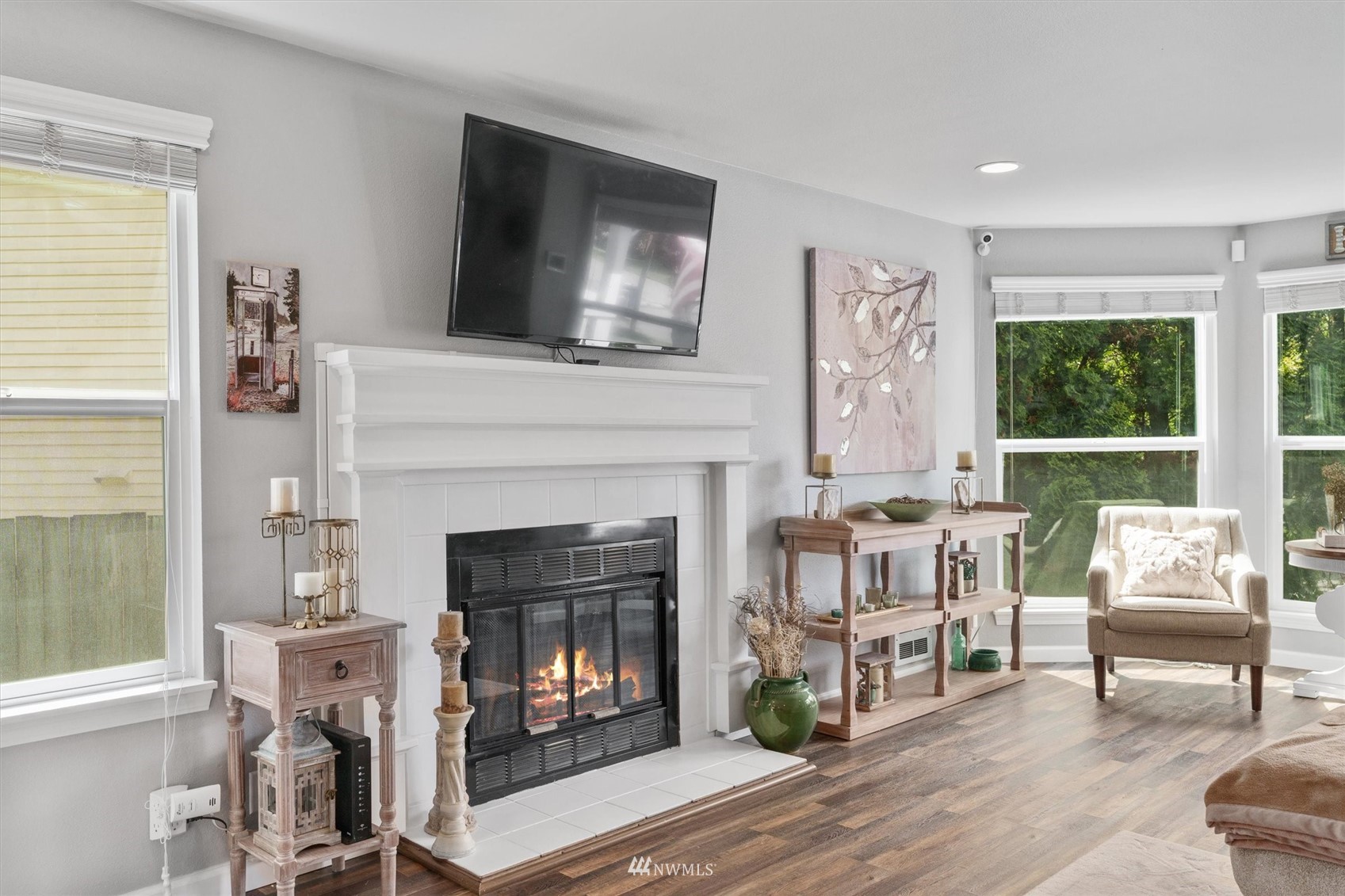 1208 228th Place Southwest Bothell, WA 98021 - Photo 12 of 33 a living room with furniture and a fireplace