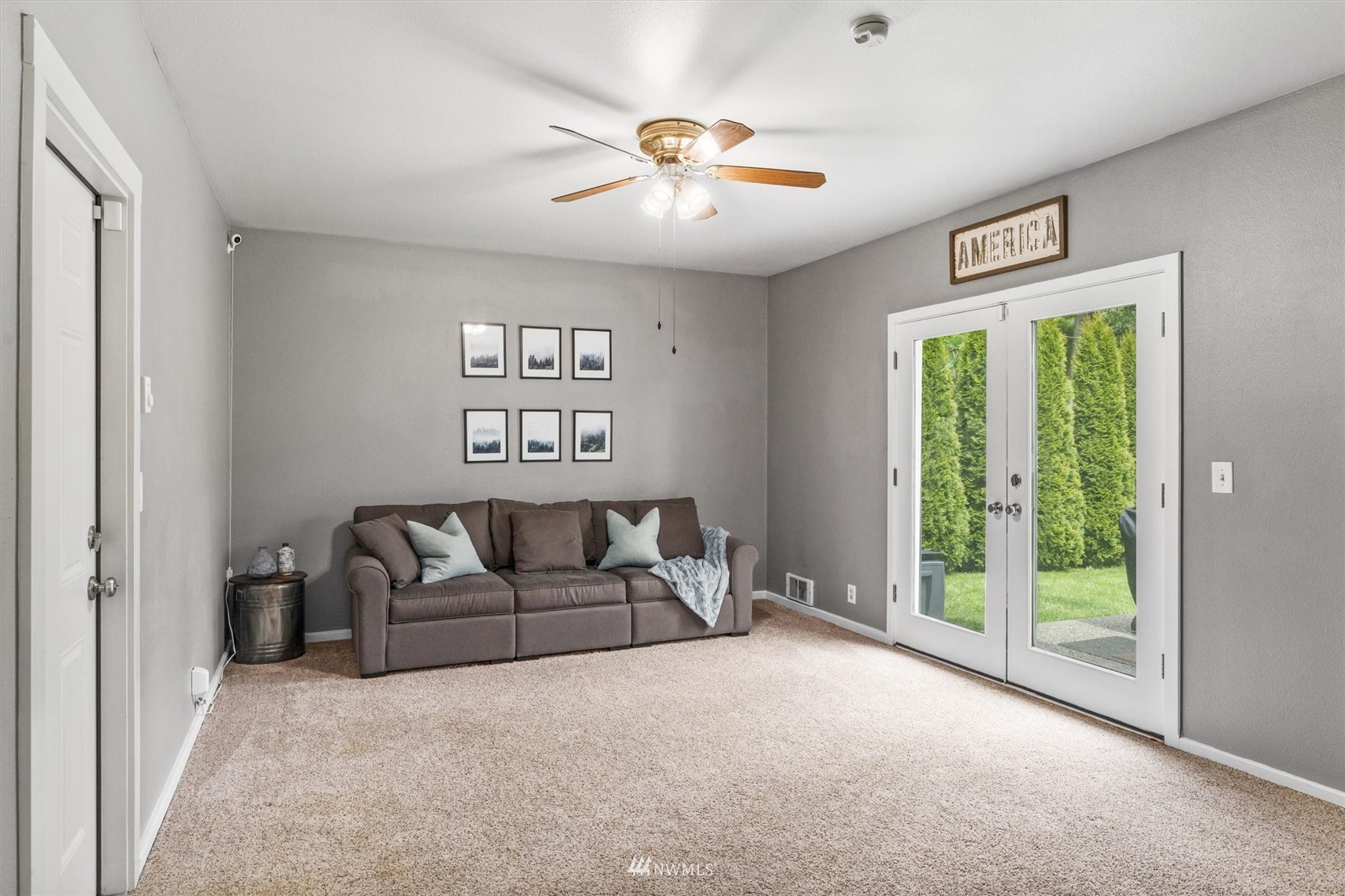 1208 228th Place Southwest Bothell, WA 98021 - Photo 13 of 33 a living room with furniture and a large window