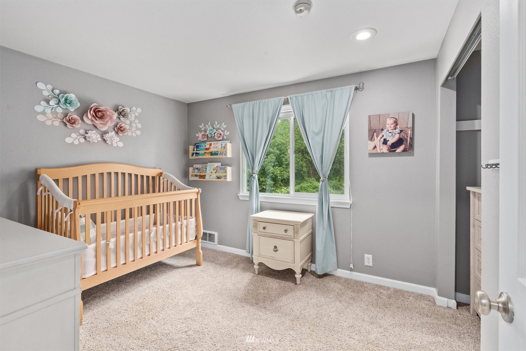 1208 228th Place Southwest Bothell, WA 98021 - Photo 20 of 33 a bedroom with a baby bed a window and a baby crib