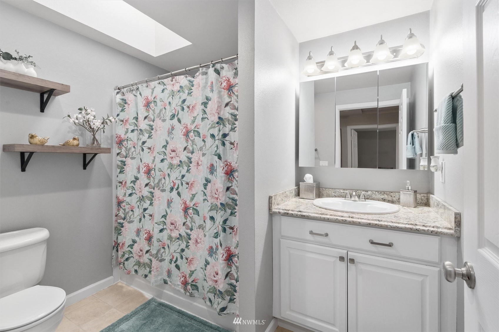 1208 228th Place Southwest Bothell, WA 98021 - Photo 22 of 33 a bathroom with a sink and a mirror
