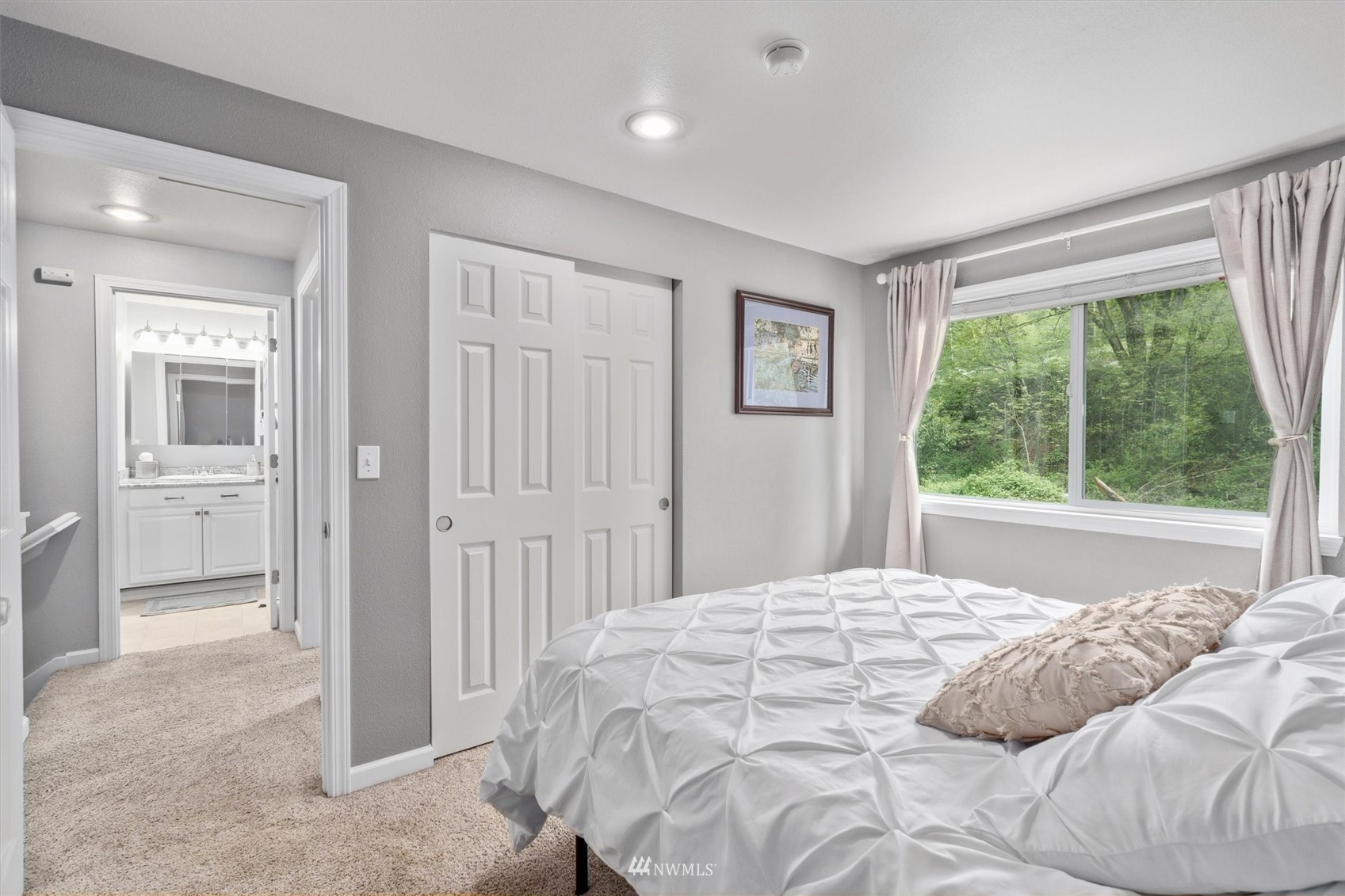 1208 228th Place Southwest Bothell, WA 98021 - Photo 24 of 33 a bedroom with a bed and a large window