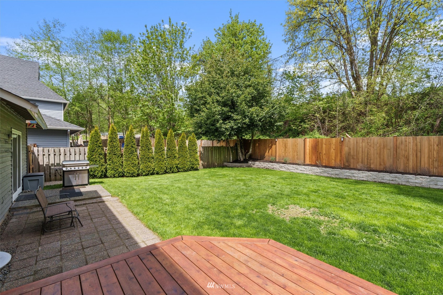 1208 228th Place Southwest Bothell, WA 98021 - Photo 25 of 33 a view of a backyard with sitting area