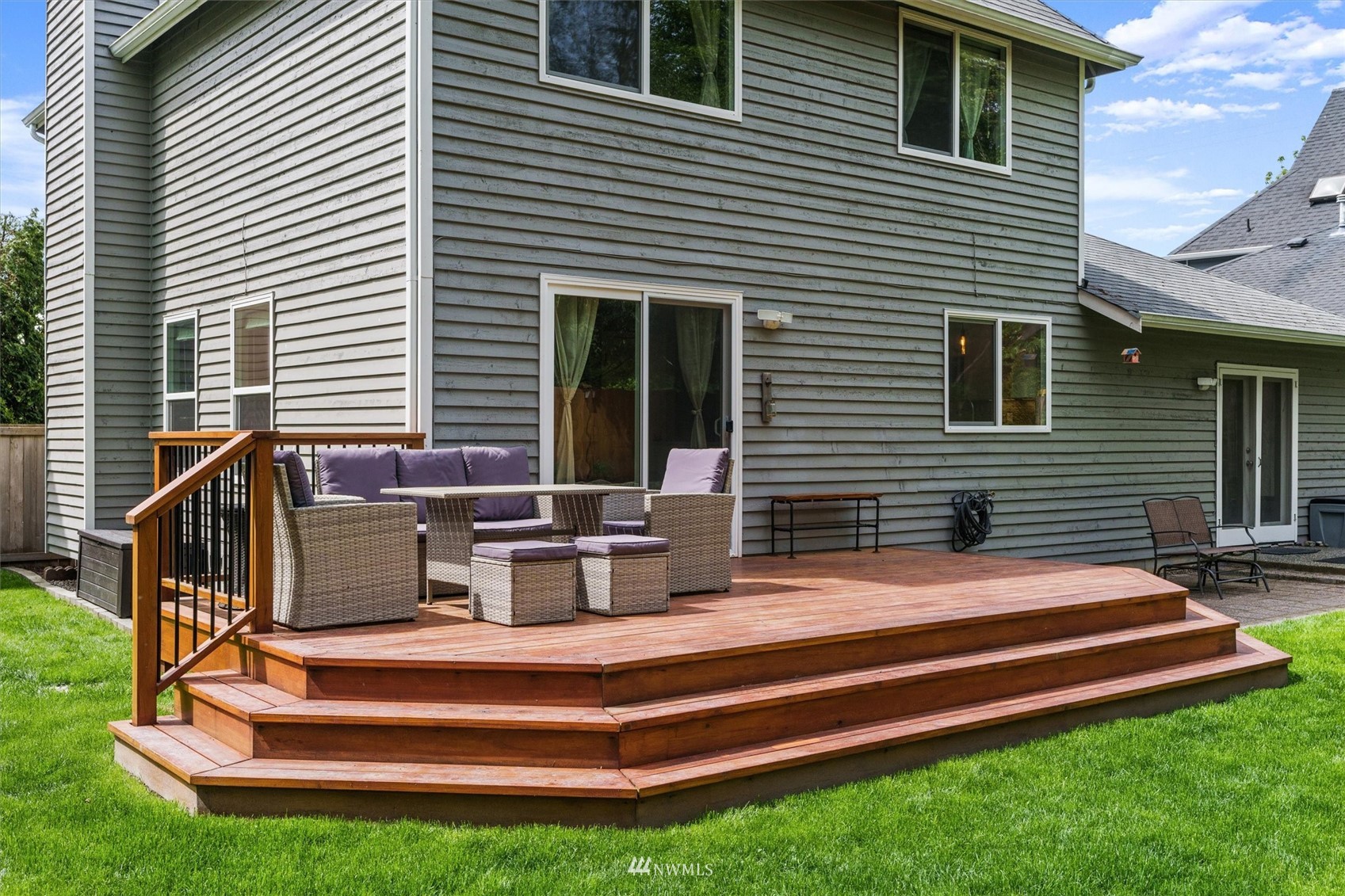 1208 228th Place Southwest Bothell, WA 98021 - Photo 28 of 33 a view of backyard with a chair and potted plants