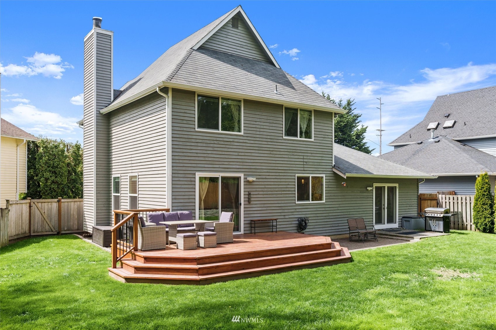 1208 228th Place Southwest Bothell, WA 98021 - Photo 29 of 33 a front view of house with a garden and patio