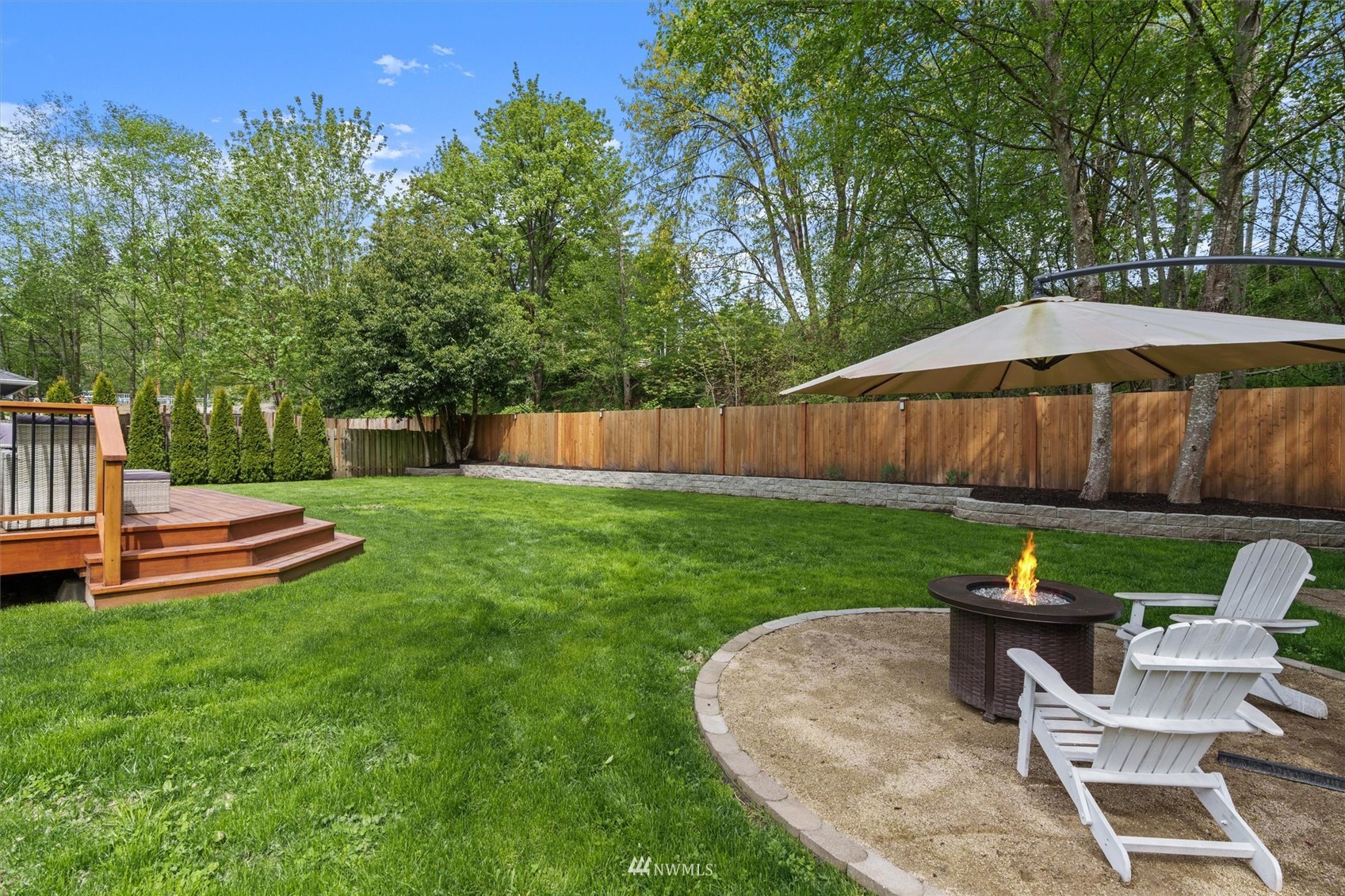 1208 228th Place Southwest Bothell, WA 98021 - Photo 30 of 33 a view of a backyard with sitting area