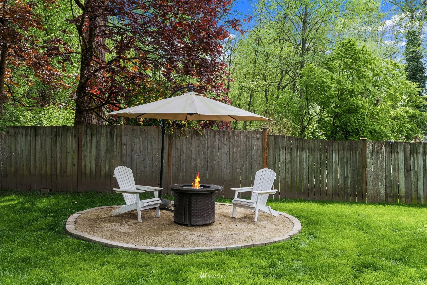 1208 228th Place Southwest Bothell, WA 98021 - Photo 31 of 33 a table and chairs in the garden