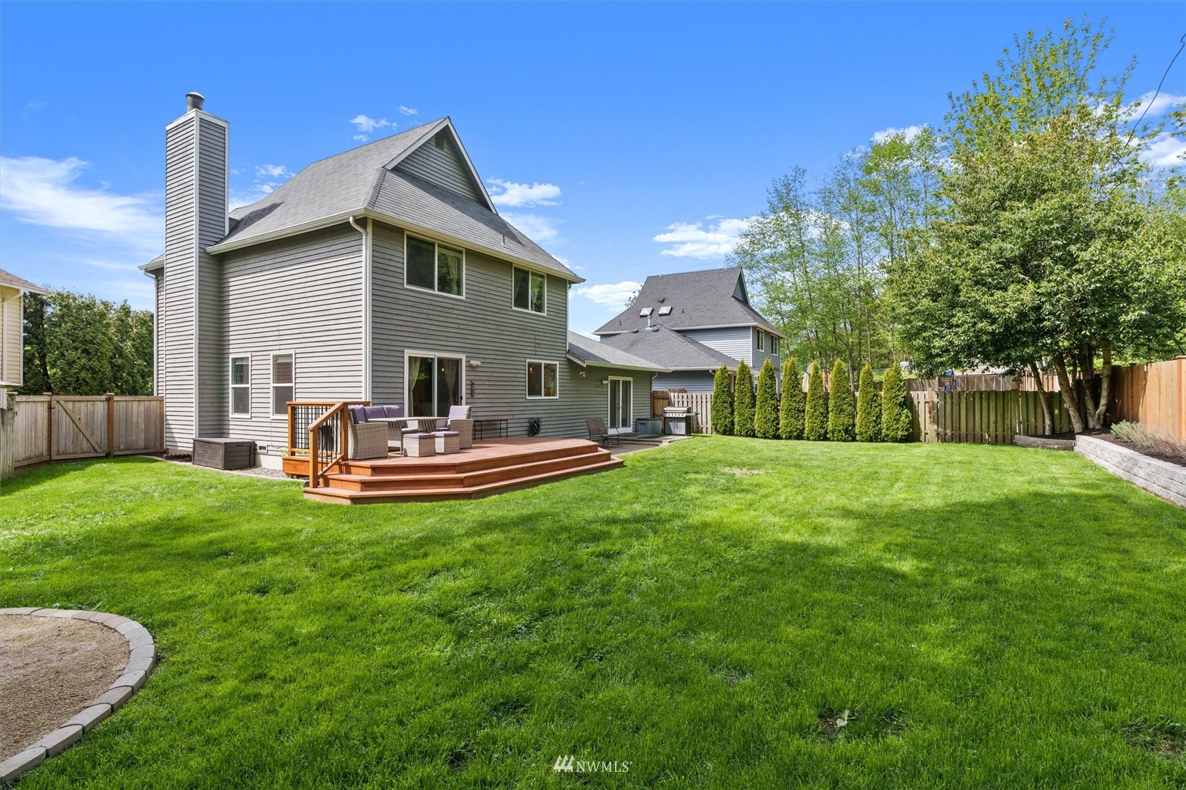 1208 228th Place Southwest Bothell, WA 98021 - Photo 32 of 33 a house view with a sitting space and garden