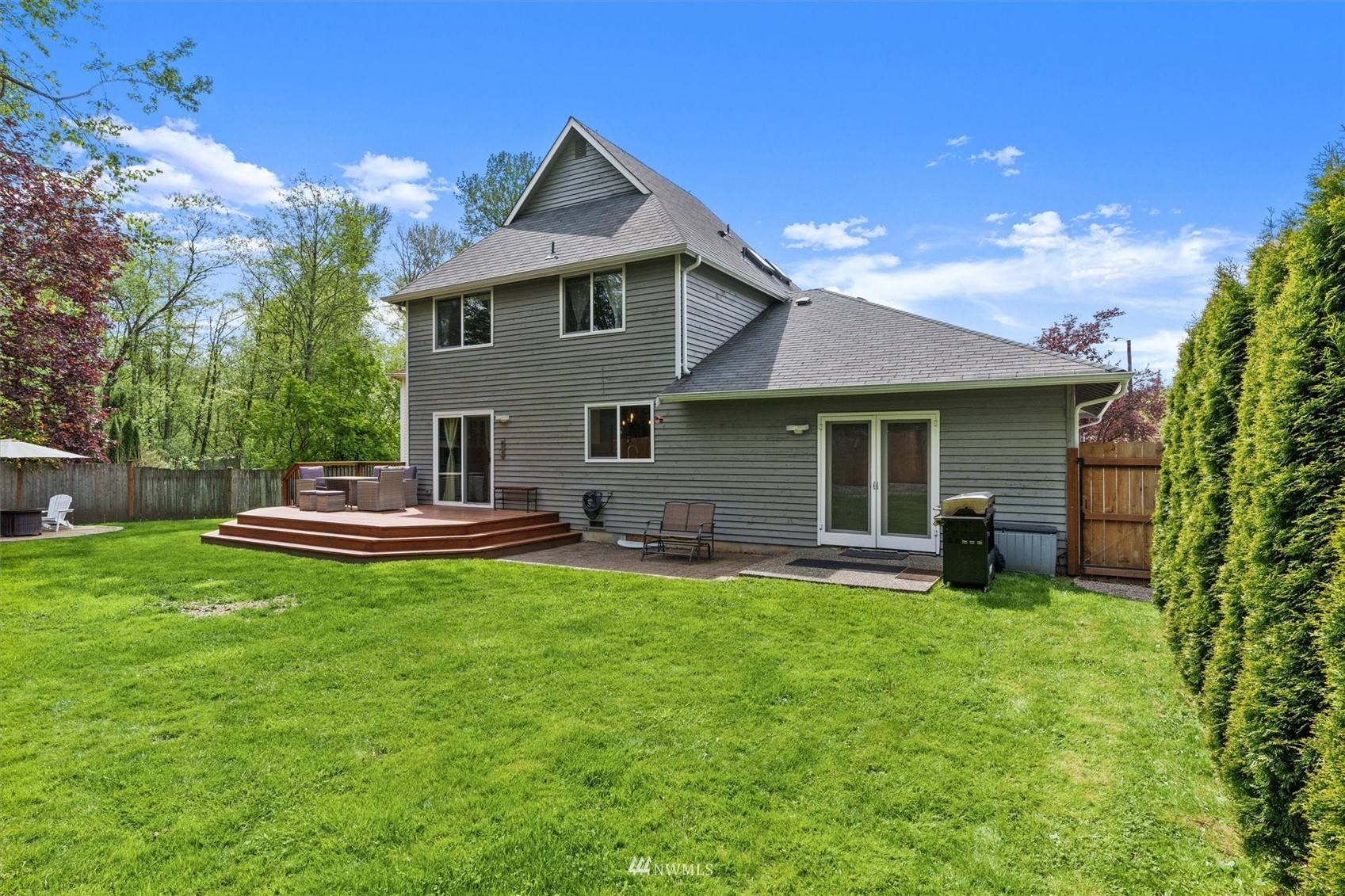 1208 228th Place Southwest Bothell, WA 98021 - Photo 33 of 33 a front view of a house with a garden and patio