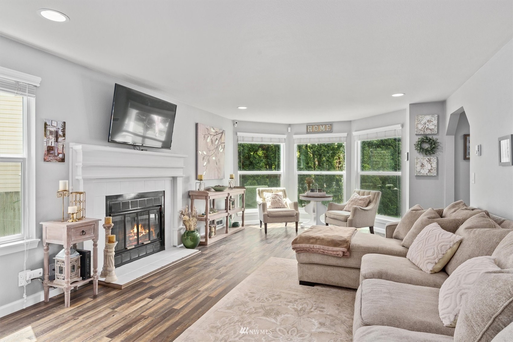 1208 228th Place Southwest Bothell, WA 98021 - Photo 10 of 33 a living room with furniture and a fireplace