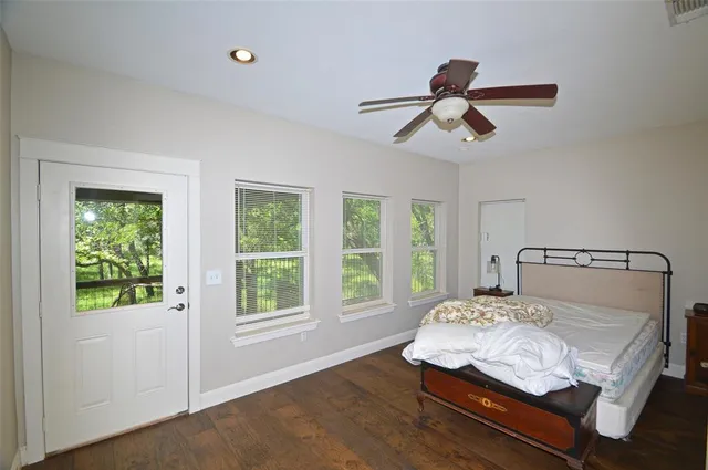 a bedroom with a bed and window