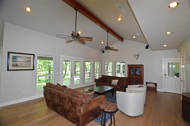 a living room with furniture and a large window