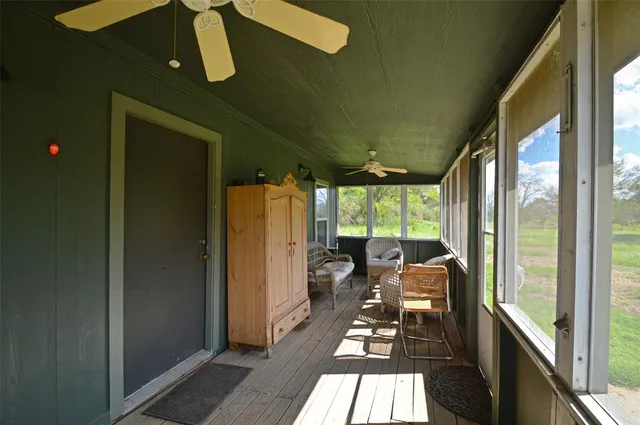 a room with furniture and a large window