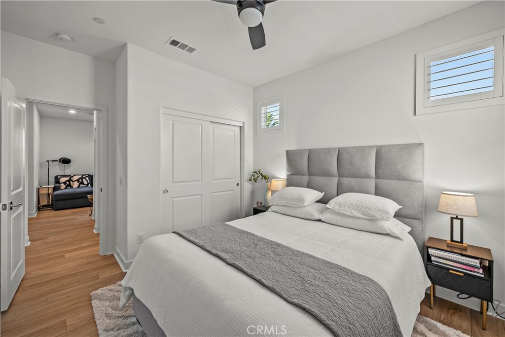 1663 Rosewell Road West Covina, CA 91791 - Photo 29 of 45 a bedroom with a bed and wooden floor