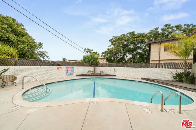a view of a outdoor space with swimming pool
