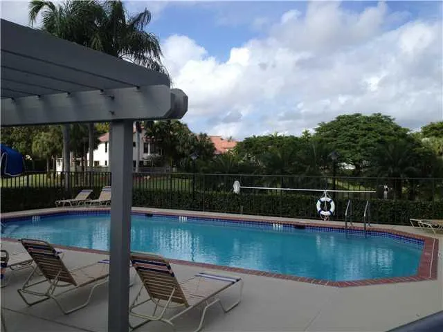 a view of swimming pool with a patio