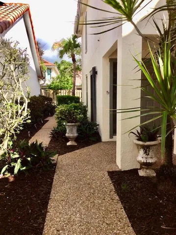 a view of a backyard with sitting area