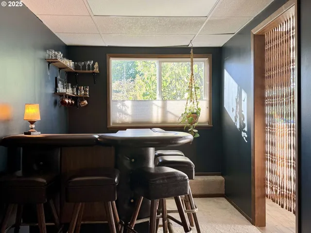 a view of a dining room with furniture and window