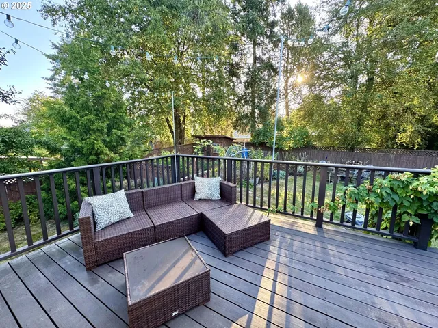 a view of a wooden deck with furniture